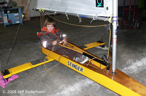 young sailor in an ice opti